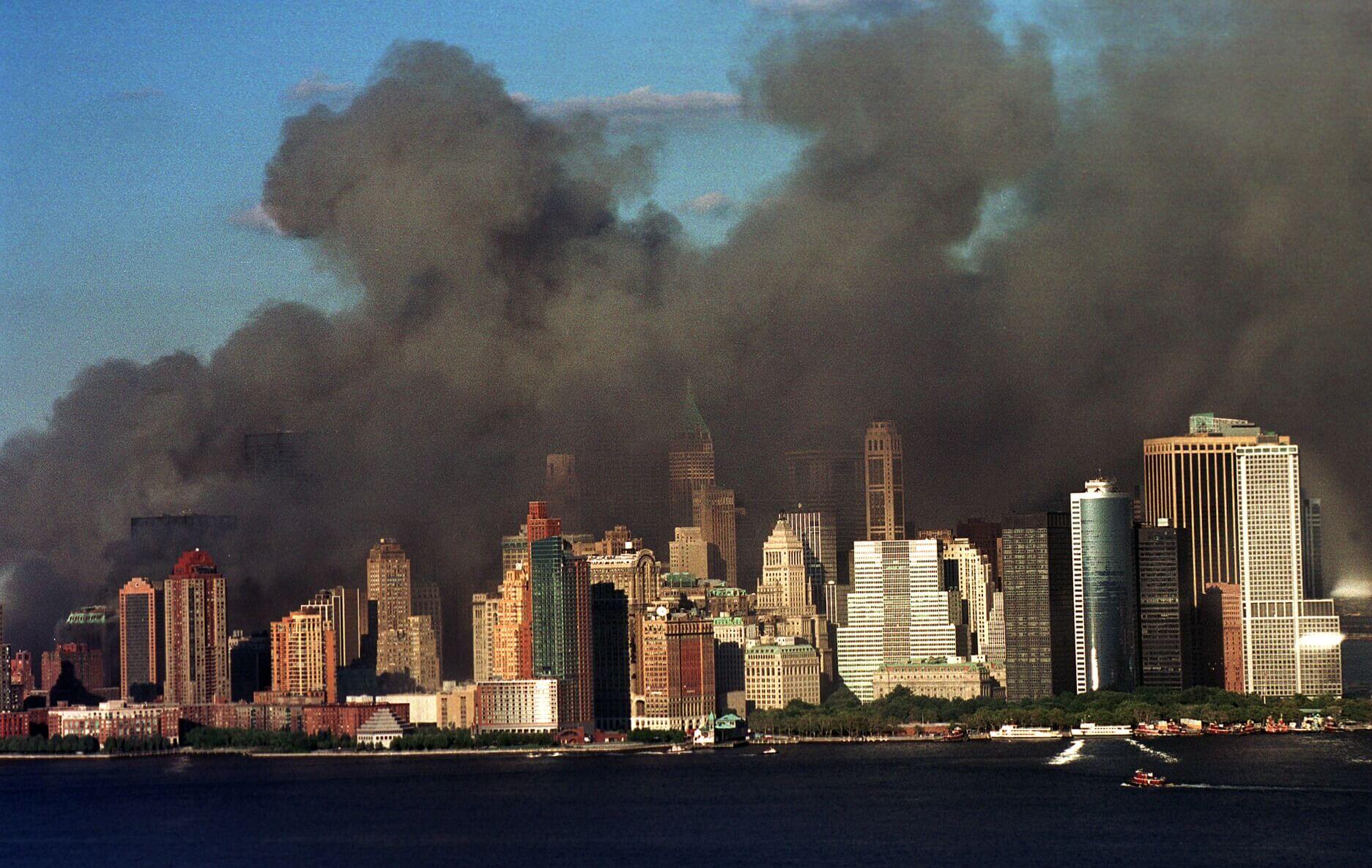 Smoke is seen across the New York City skyline as the towers fall