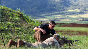 A montage of Army marksmen aiming their weapons.