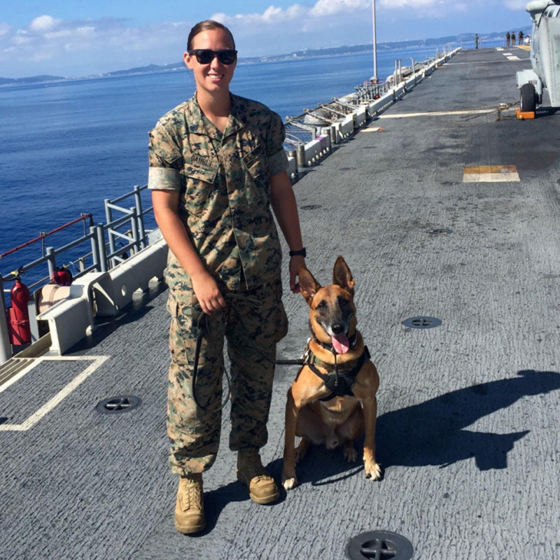 Marine Corps Sgt. Jenna Cauble, who adopted Bbutler, her first canine partner, four years after working with him