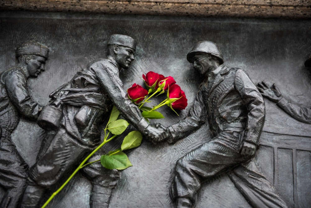 Red roses placed on the National World War II Memorial during the Victory in Europe Day observance at the memorial in Washington, May 8, 2019