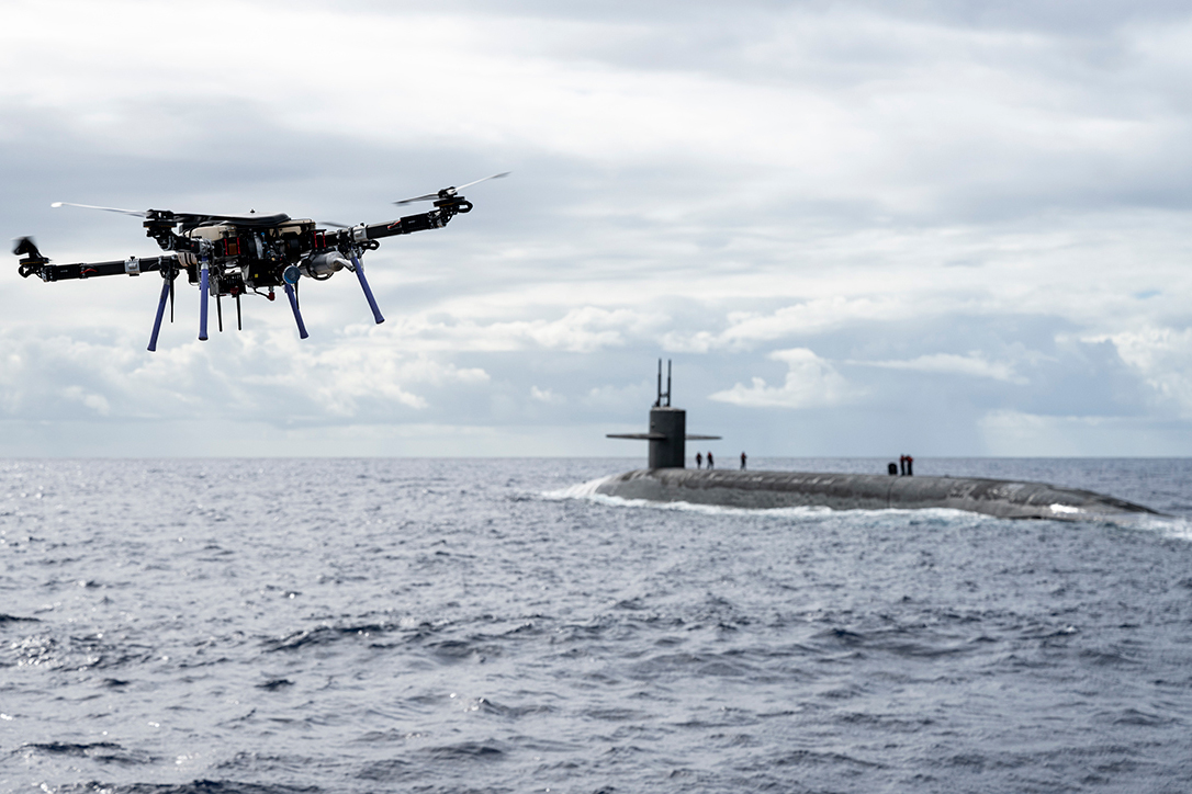 An unmanned aerial vehicle delivers a payload to the Ohio-class ballistic-missile submarine USS Henry M. Jackson (SSBN 730) around the Hawaiian Islands.