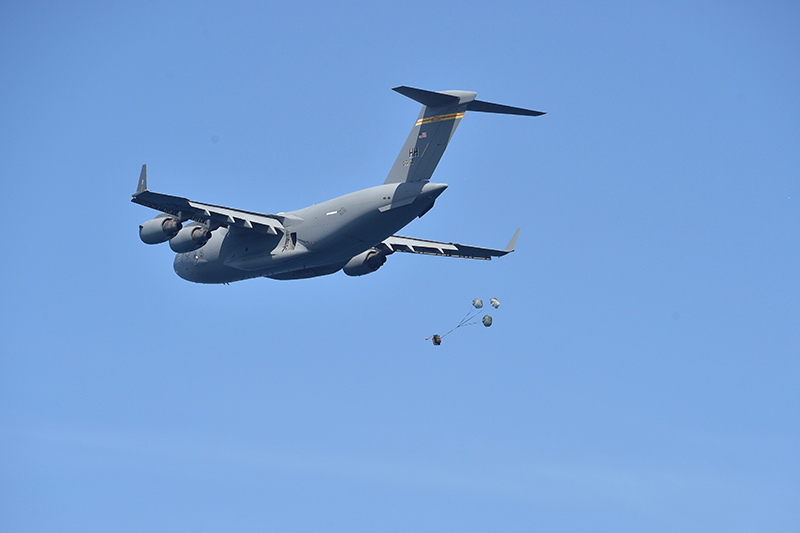 A C-17 Globemaster III dropping payload.