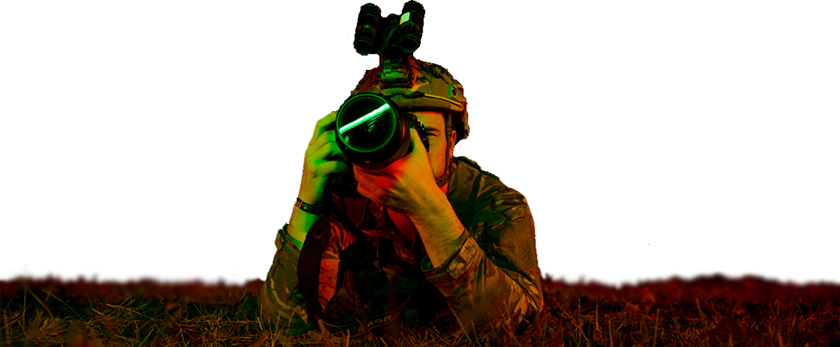 Soldier set up with camera, capturing a photo.