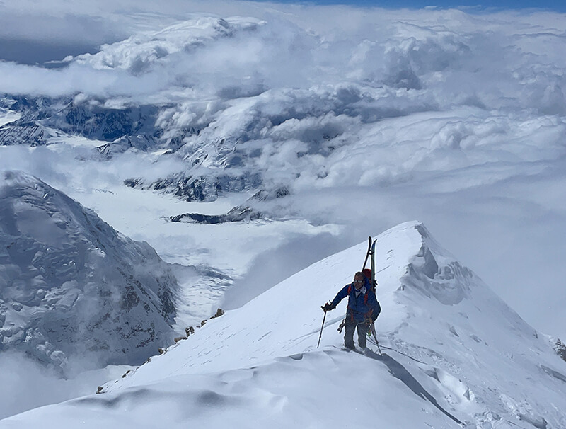 team member on mountain top thumbnail