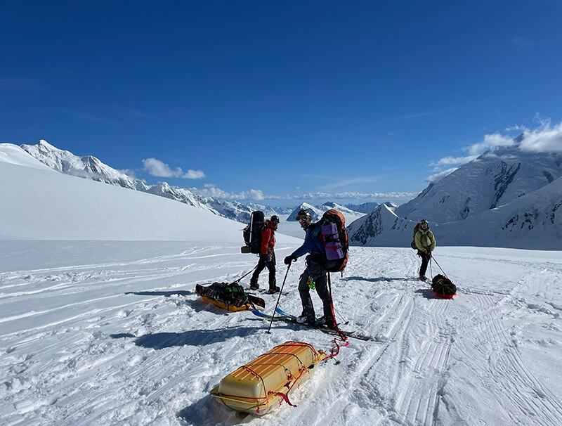 team members pulling sleds with equipment thumbnail