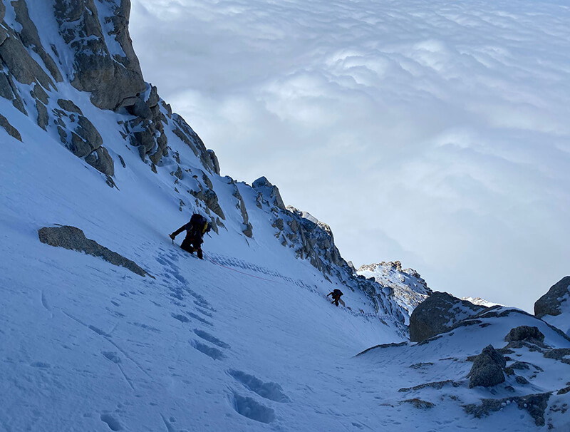 team on step incline of the mountain thumbnail