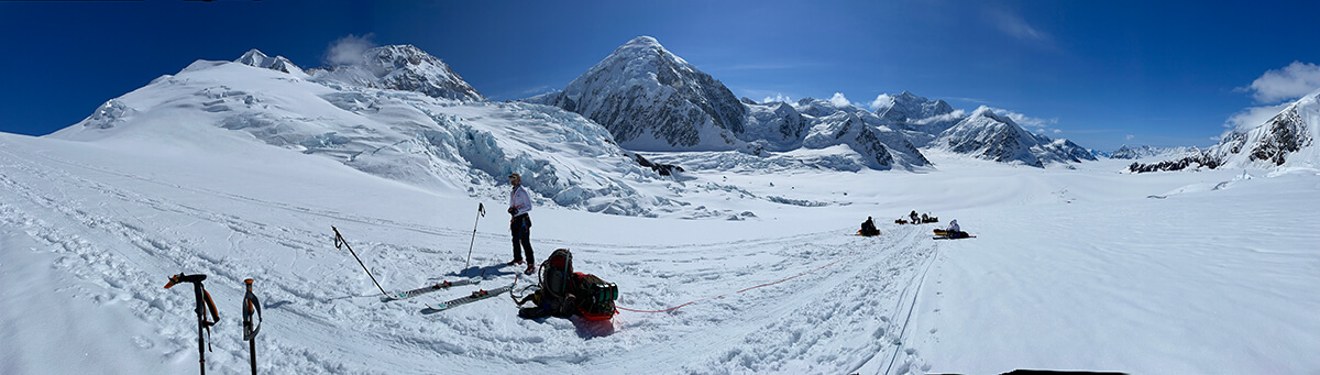 another panoramic view of team on mountain