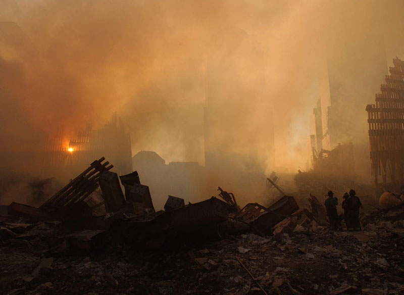 The sun filters through the smoke and rubble at ground zero.