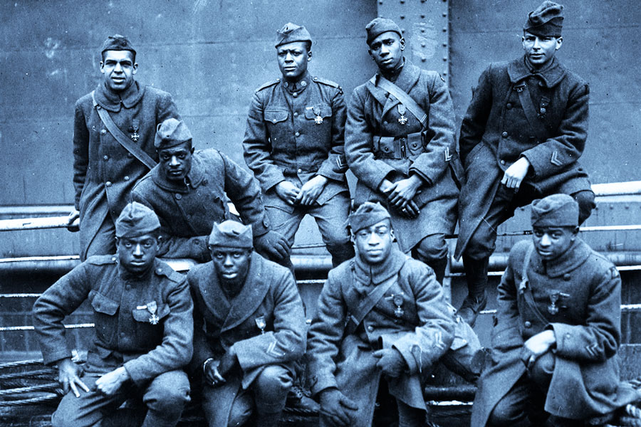 Soldiers in an all-black regiment called the Harlem Hellfighters pose with their awards for gallantry in combat, 1919.